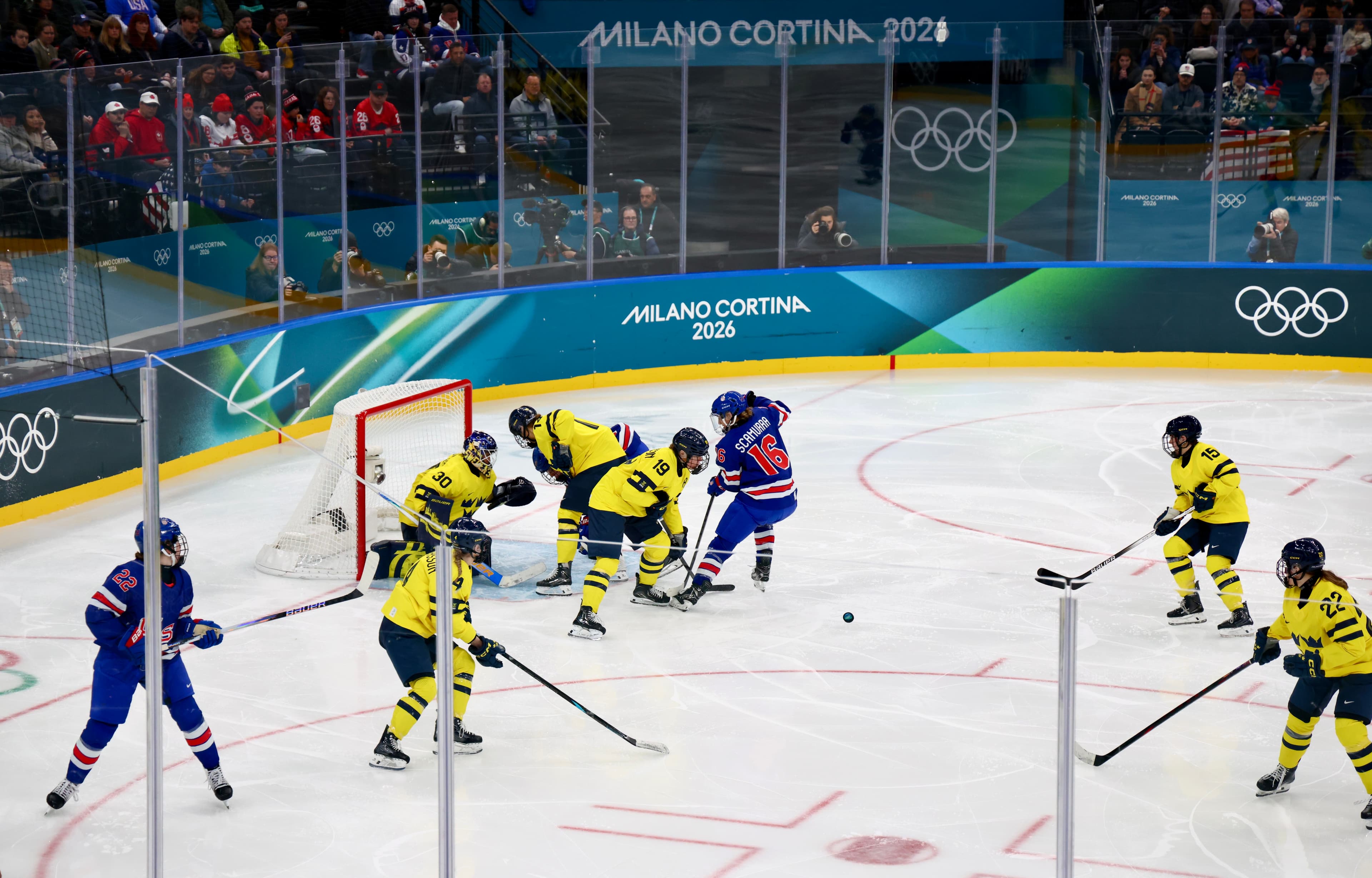 USA and Sweden players in full offensive attack near the net at Milano Cortina 2026