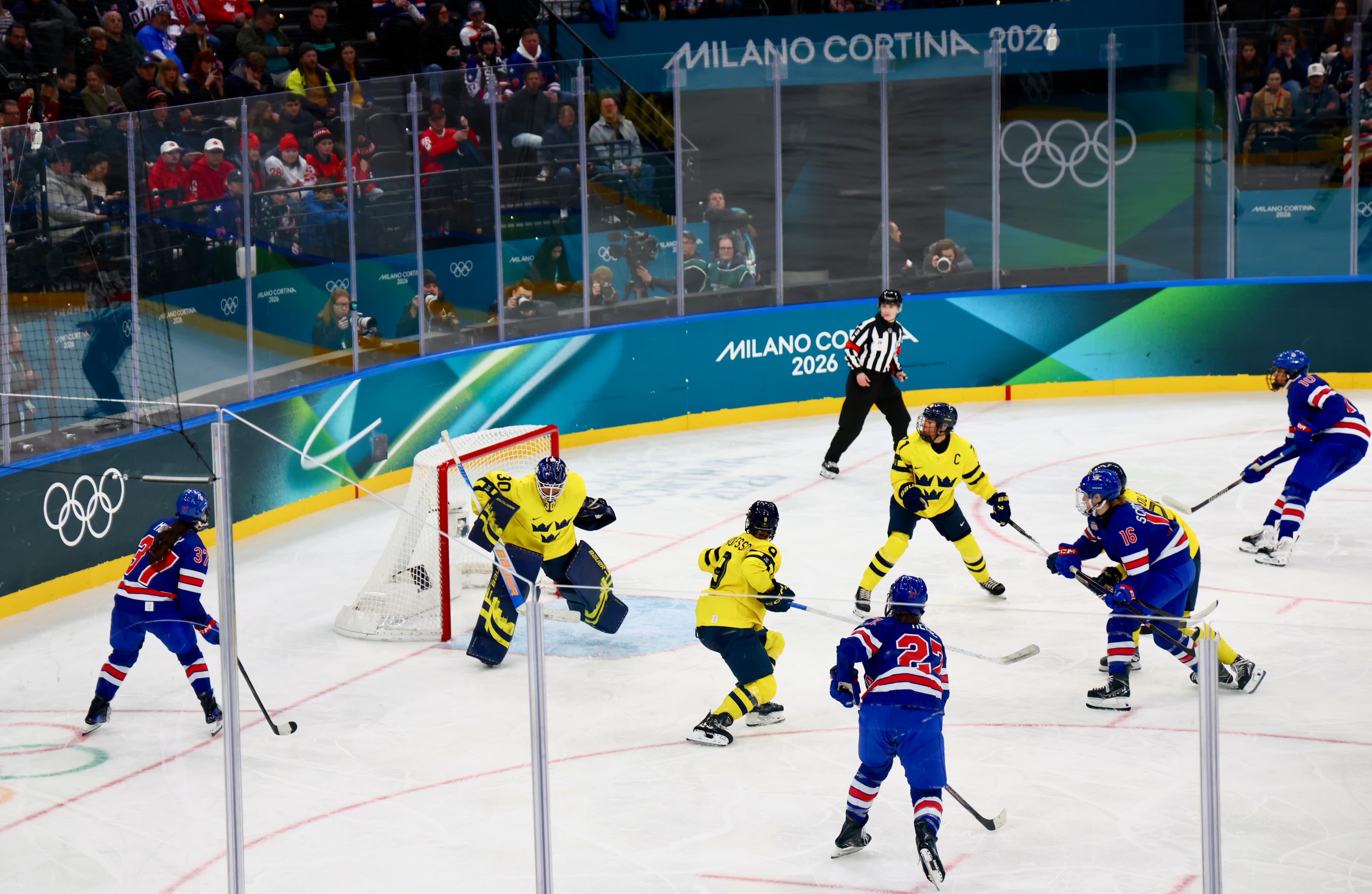 USA players pressing Sweden's goalie at the net at Milano Cortina 2026