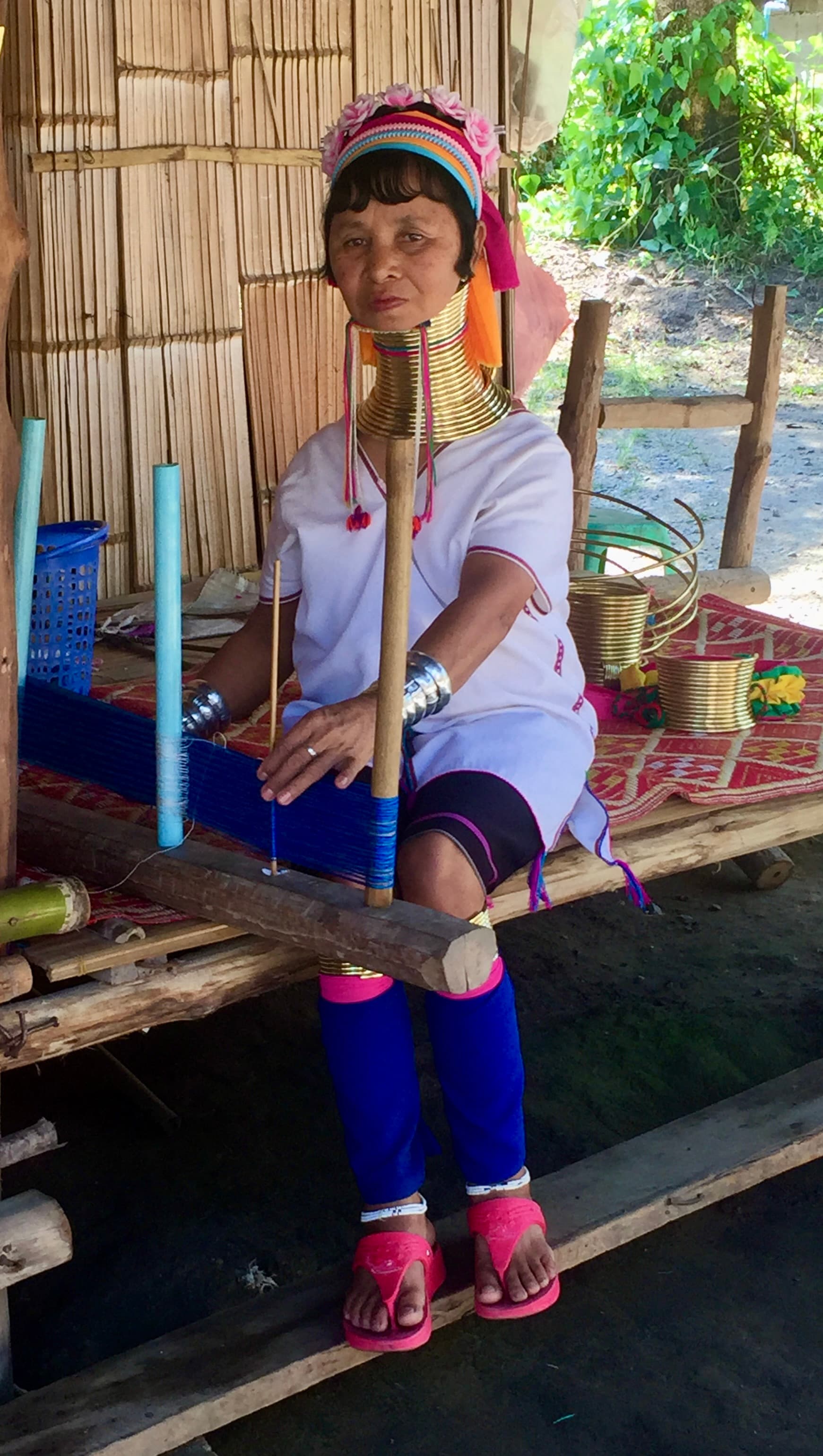 Kayan woman weaving at a traditional loom, northern Thailand